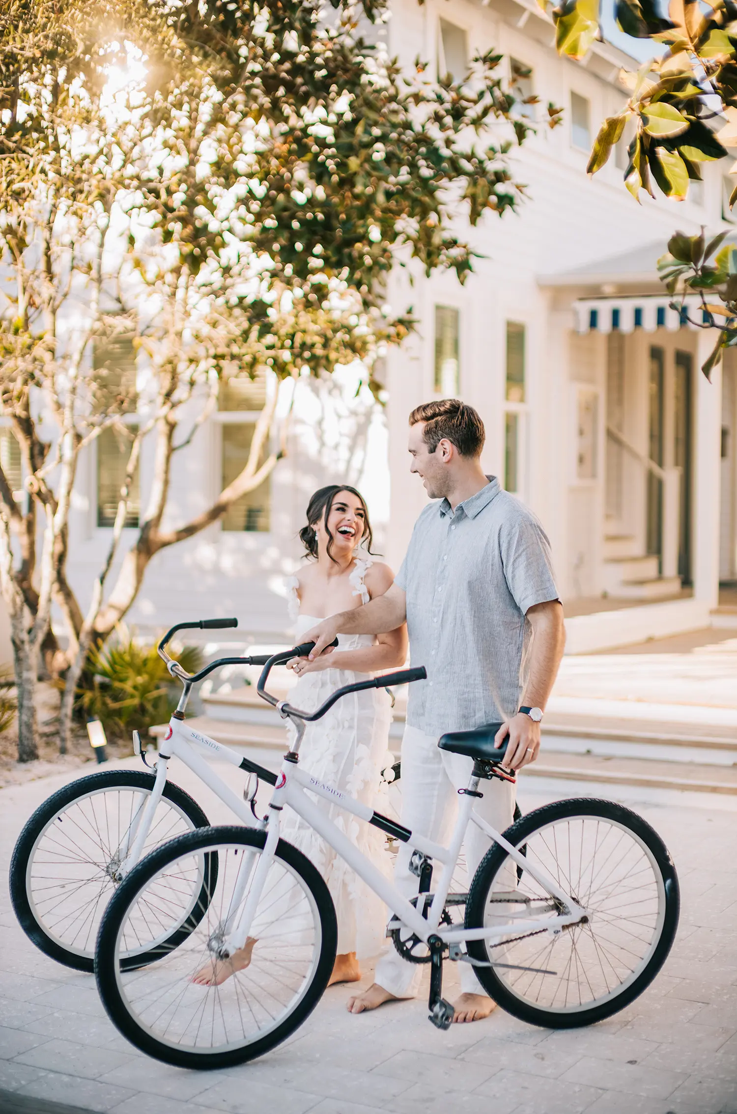 Picture of a man and woman on the street with bicycles